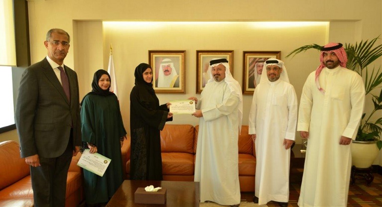 Auditor General of The National Audit Office (NAO) receives two employees who have won first place in the GCC competition for research and studies in the field of control and accounting